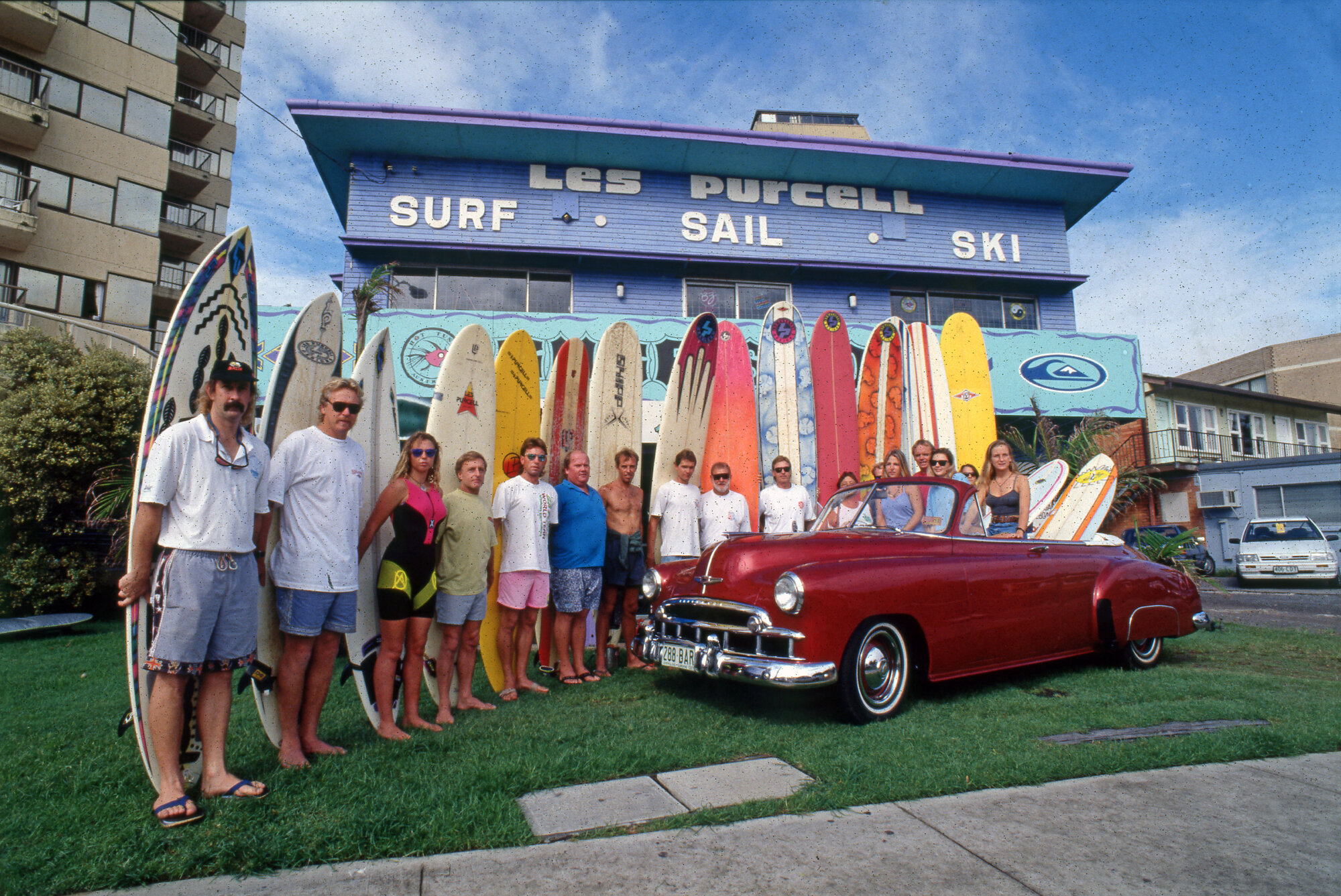 Surfers with their boards in front of the Surf Shop