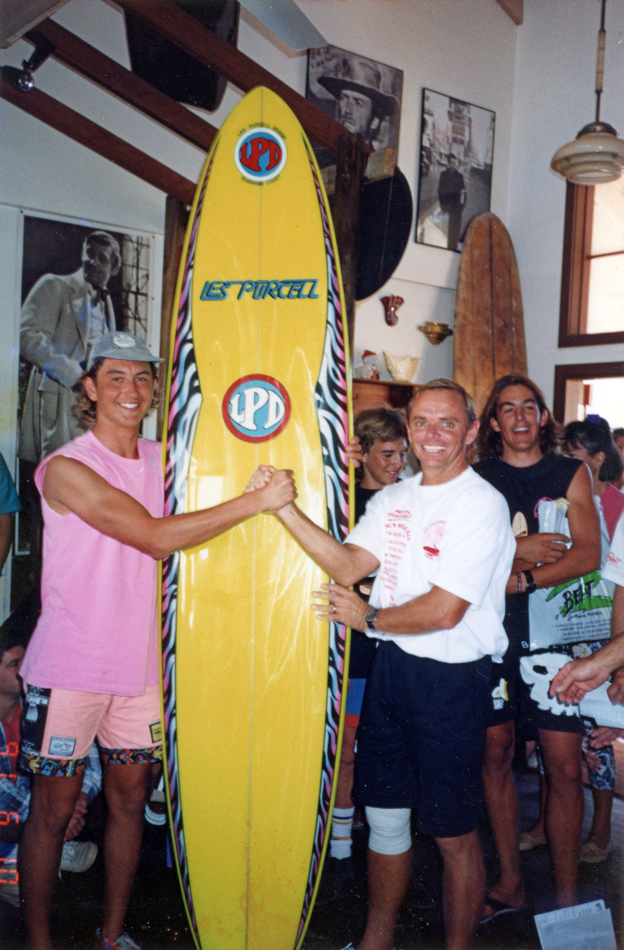 Les making a sale in the shop, ca 1980s