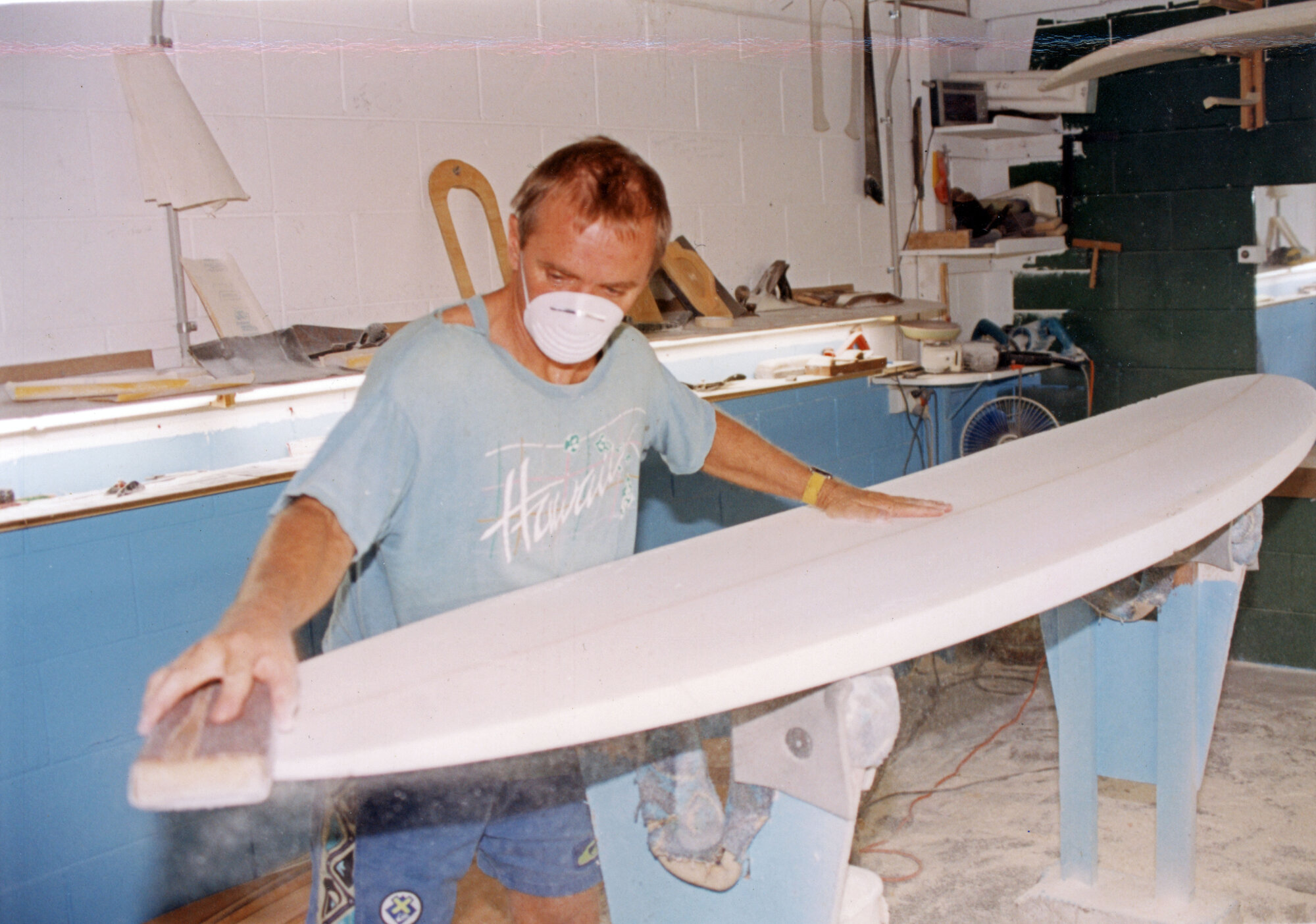 Board being shaped in the workshop