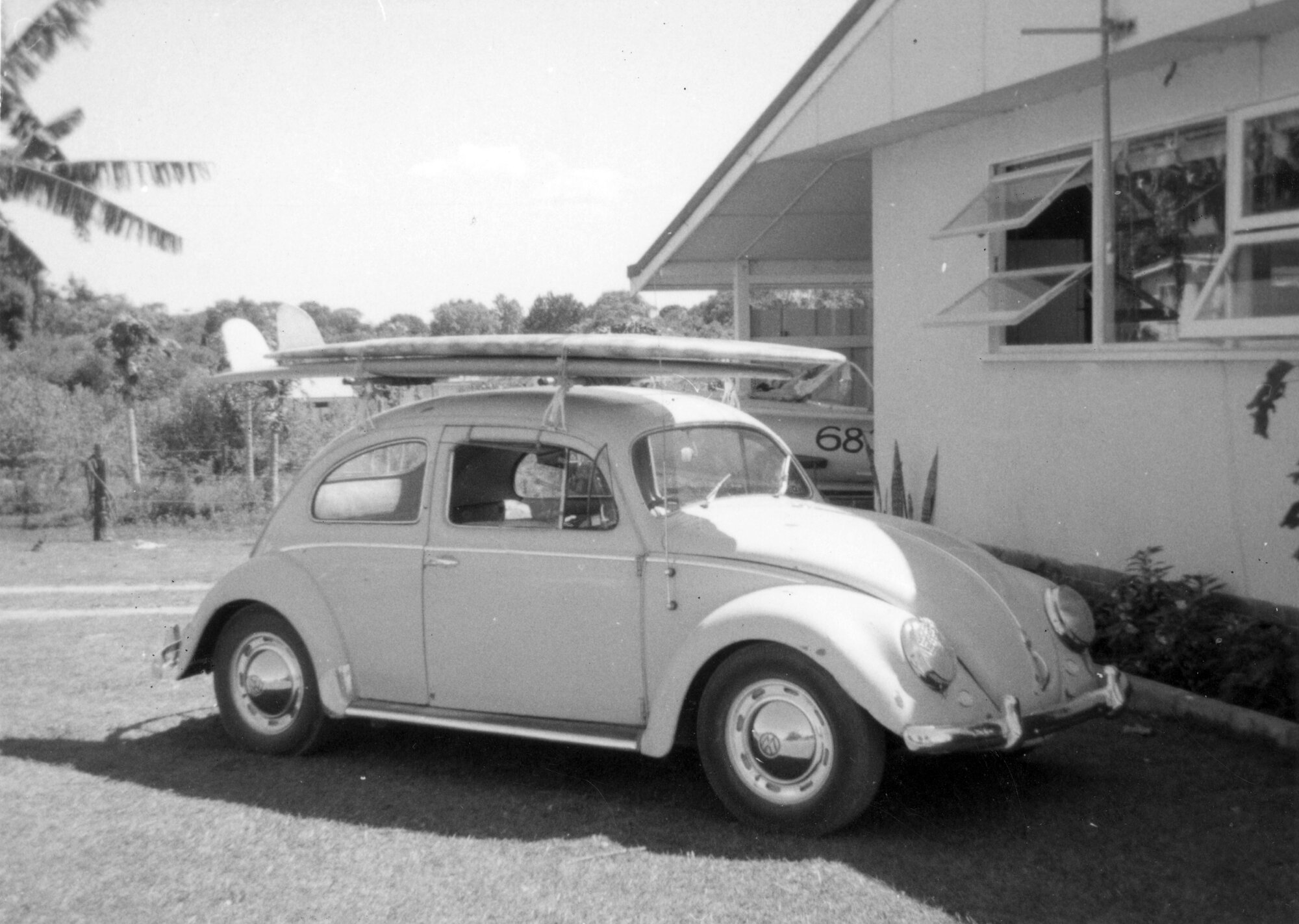 VW Beetle with surfboards, 1972