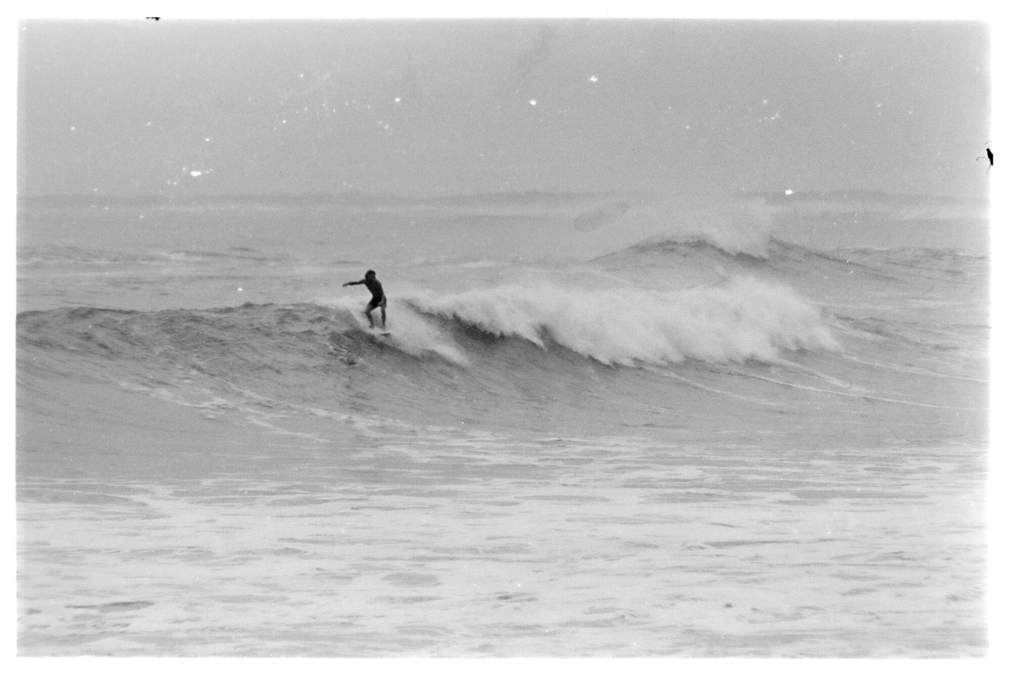 King Tide Flood Caloundra: man surfing king tide