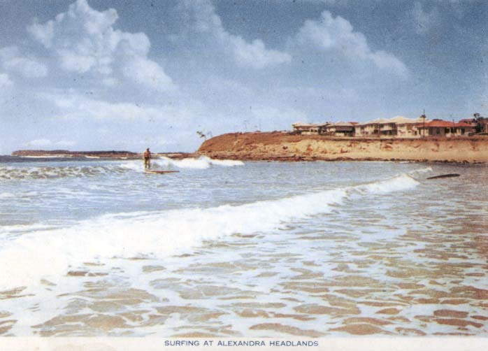 Surfing on a long board at Alexandra Headland, 1950s
