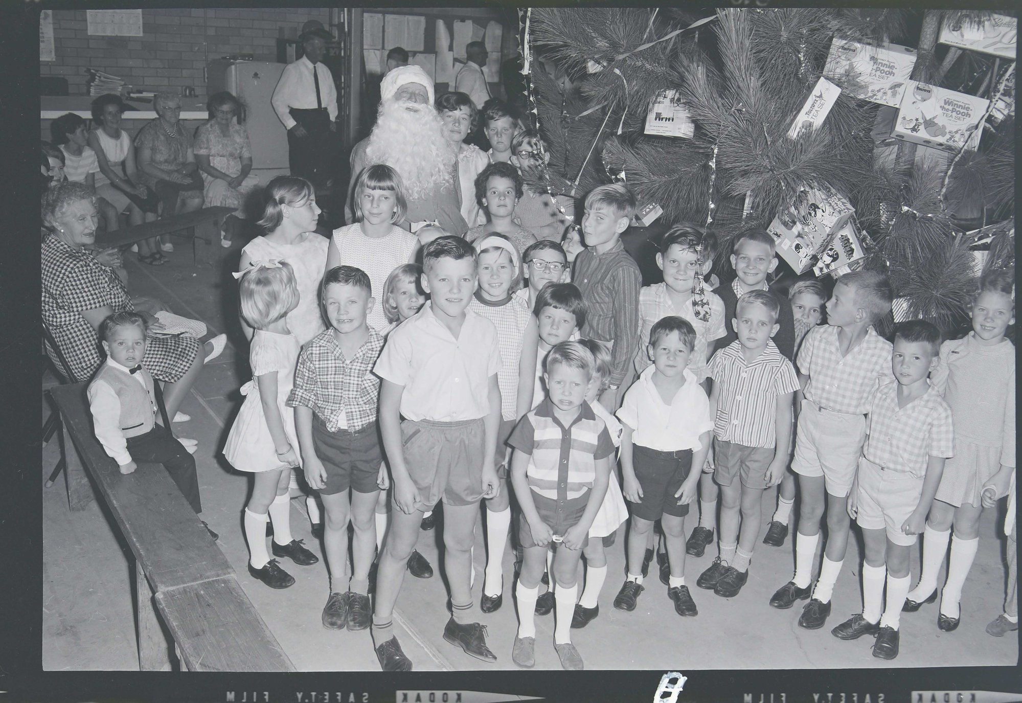 #35 - 1967 SEAQ Christmas Party 1967 - Santa with group of children