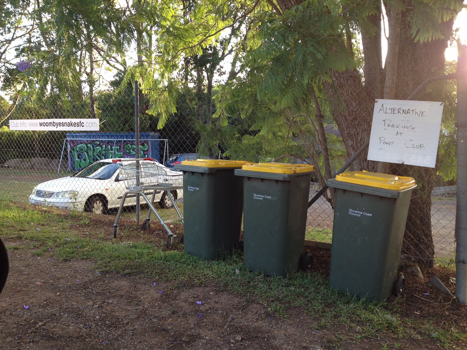 Row of recycling wheelie bins outside the Woombye Soccer Club