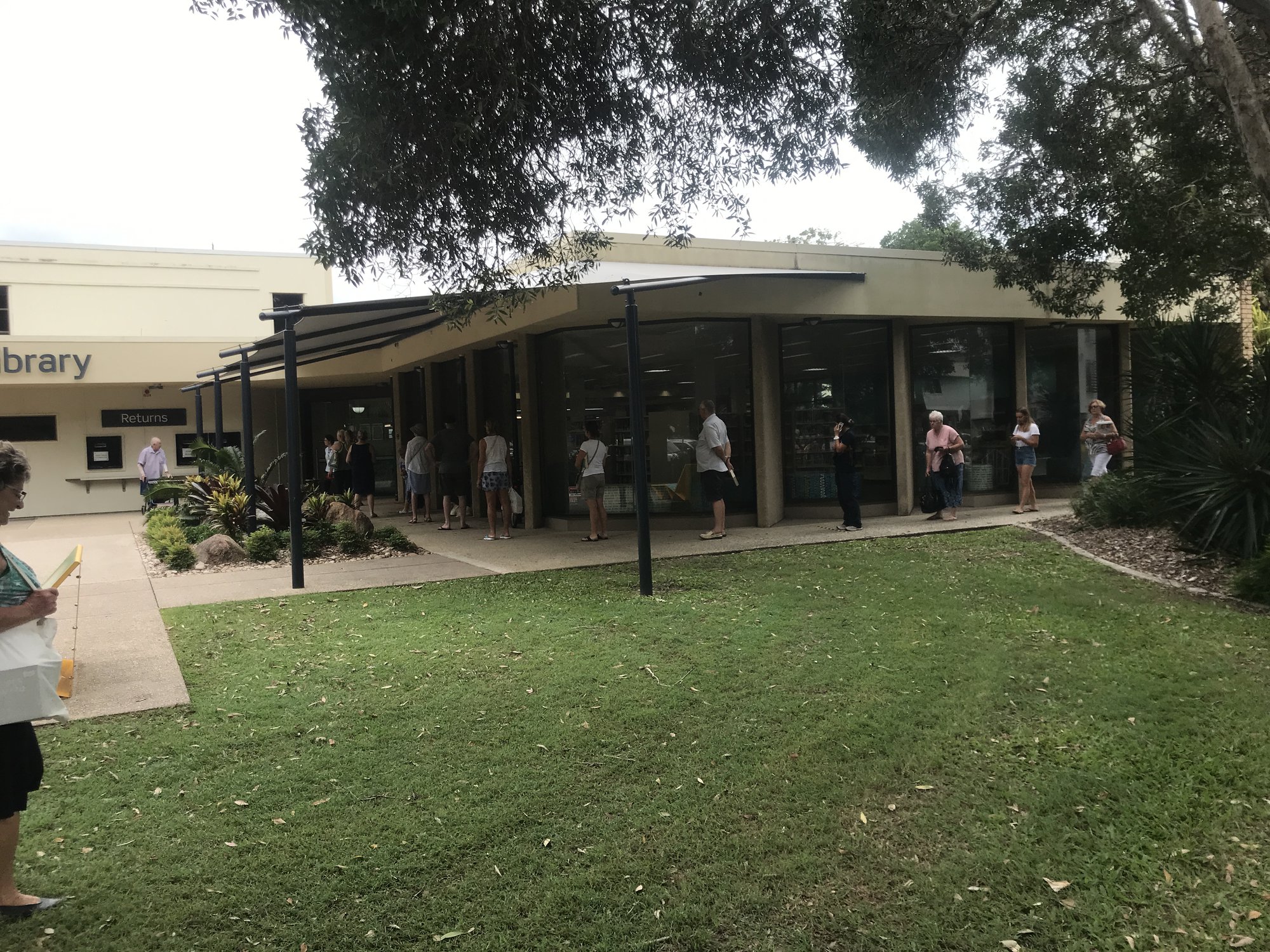 Queue at Maroochydore Library as the library is about to close due to COVID-19