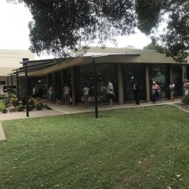 Queue at Maroochydore Library as the library is about to close due to COVID-19