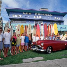 Surfers with their boards in front of the Surf Shop