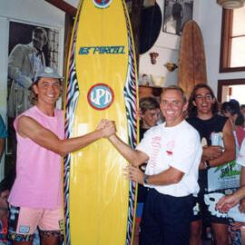 Les making a sale in the shop, ca 1980s