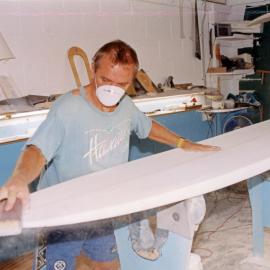 Board being shaped in the workshop