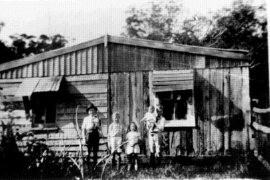 W.F. Krebs' children in front of family's slab house, Palmwoods, 1925.